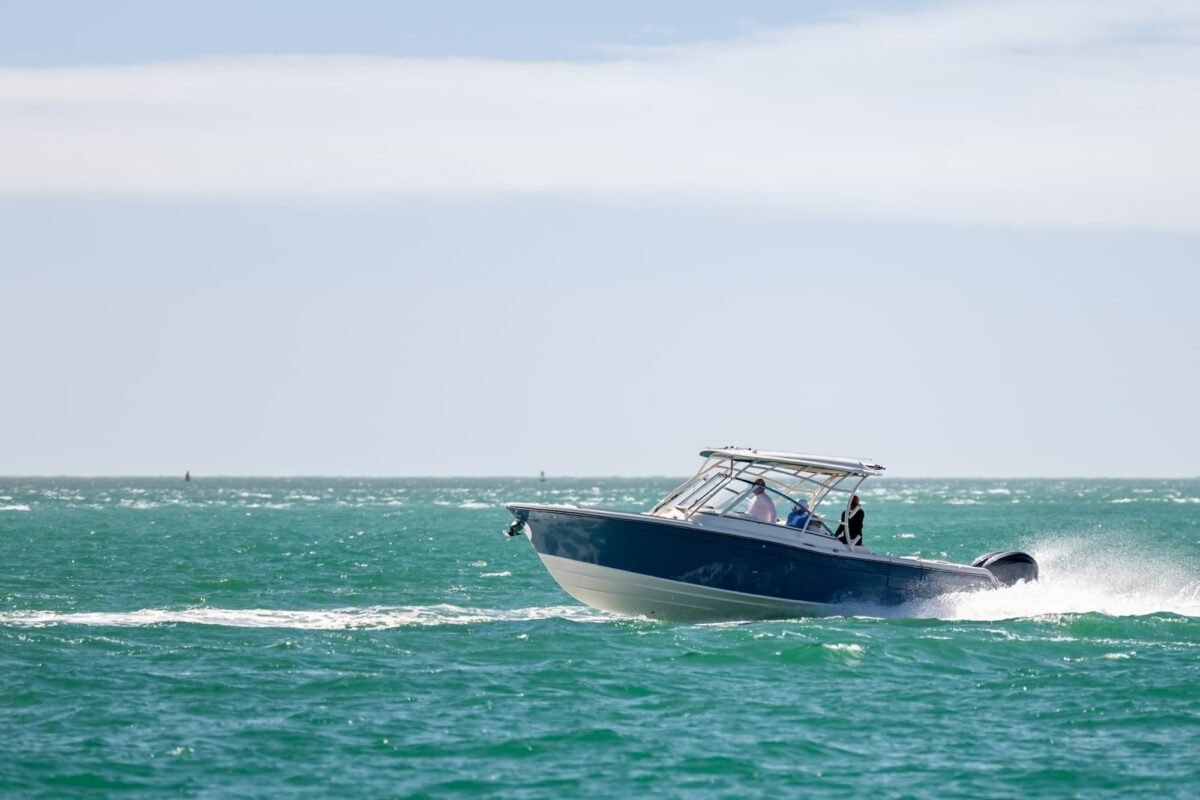 Damaged recreational boat after a collision on a Louisiana lake during summer.