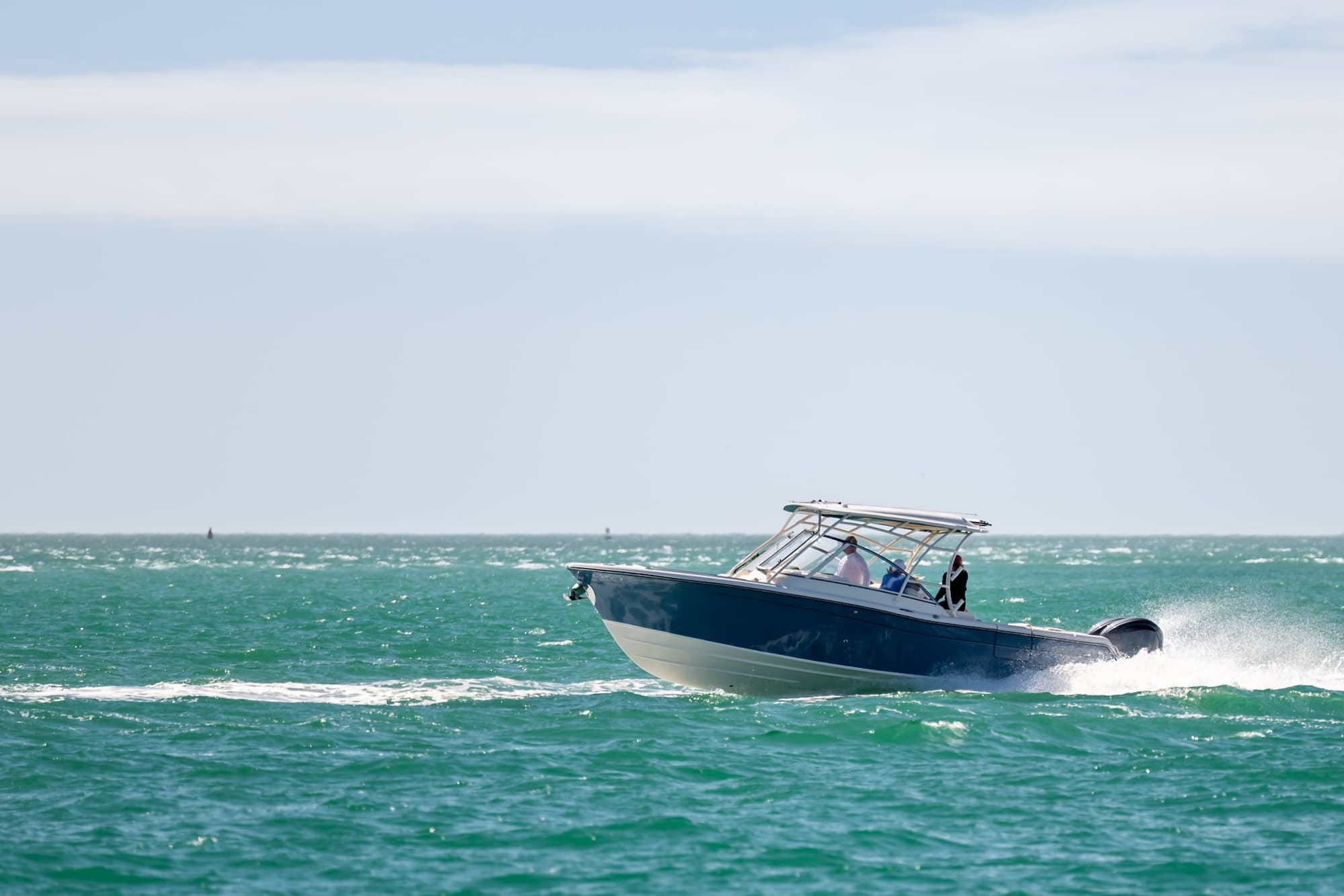 Damaged recreational boat after a collision on a Louisiana lake during summer.